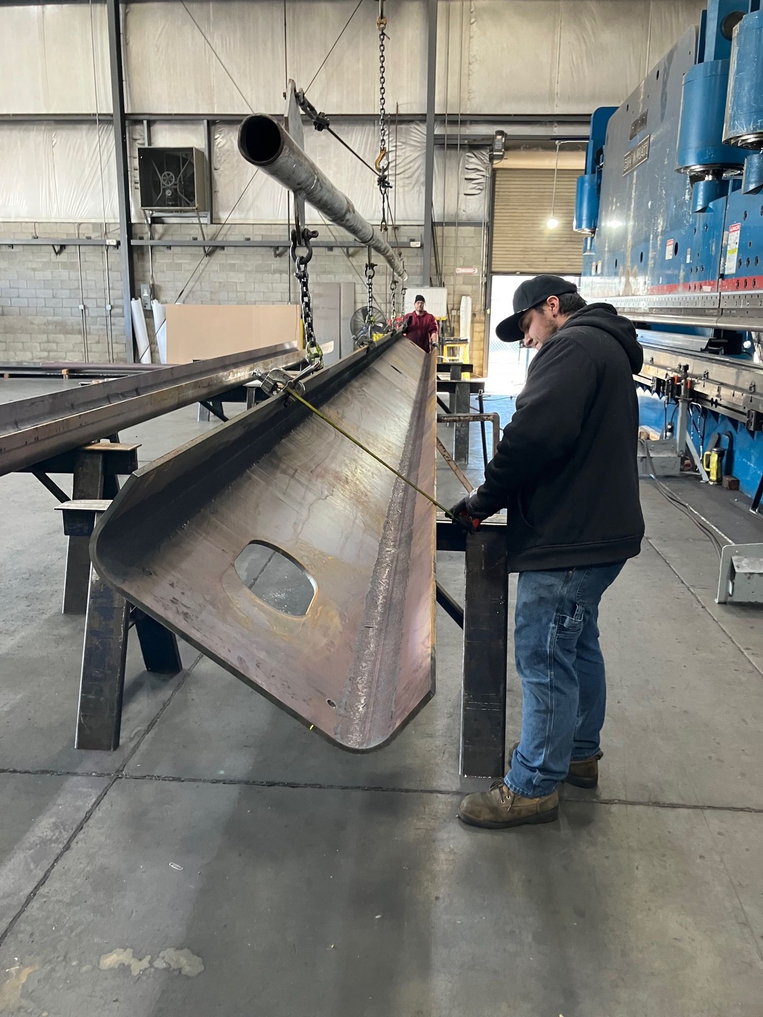 Checking close tolerance ½ inch. plate sign bridge forming